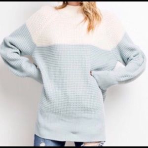 Cozy knit color block sweater with split back